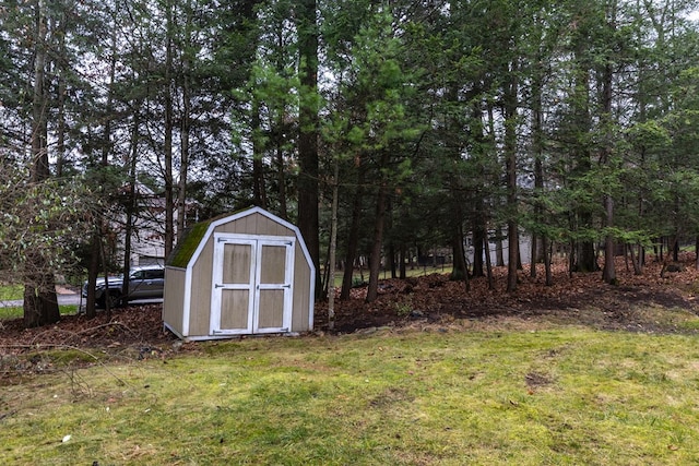 view of outbuilding with a lawn