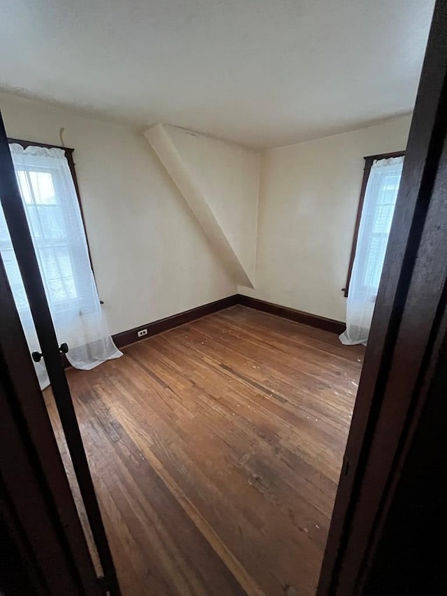 empty room with wood-type flooring