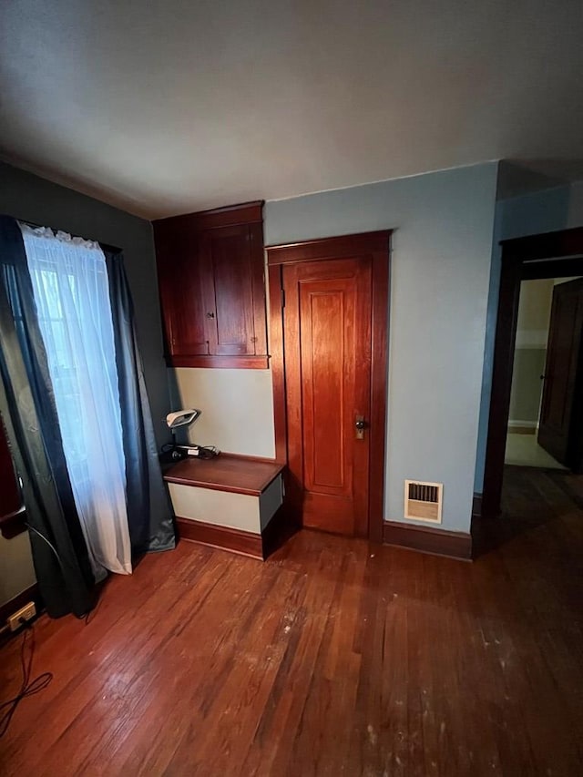 kitchen with dark hardwood / wood-style floors