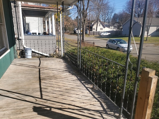 wooden terrace featuring covered porch