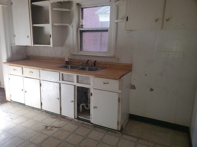 kitchen with white cabinets and sink