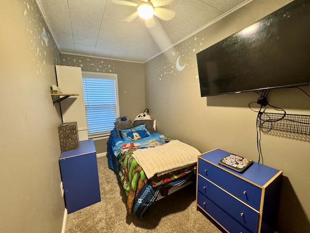 carpeted bedroom with ceiling fan and crown molding