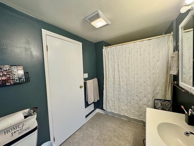 bathroom featuring vanity and a shower with curtain