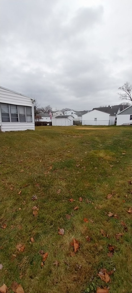 view of yard featuring a sunroom