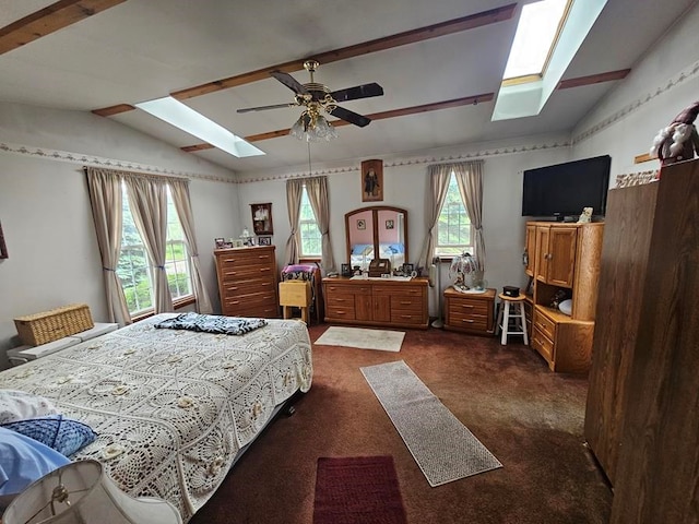 bedroom featuring multiple windows, ceiling fan, lofted ceiling, and dark colored carpet