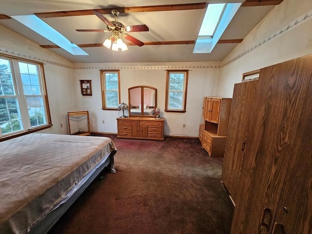 carpeted bedroom featuring multiple windows, ceiling fan, and lofted ceiling