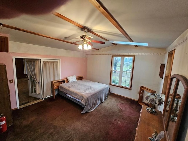 carpeted bedroom with ceiling fan and lofted ceiling