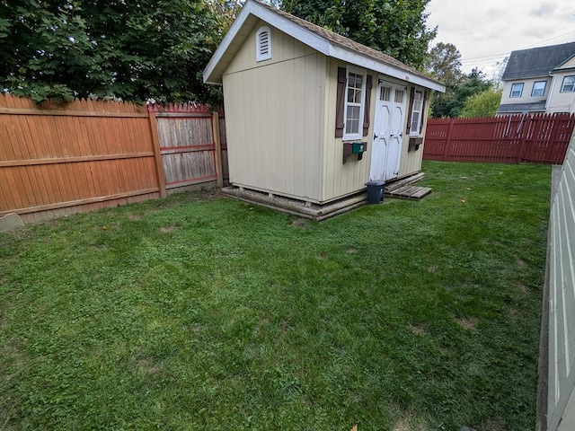 view of outbuilding featuring a yard