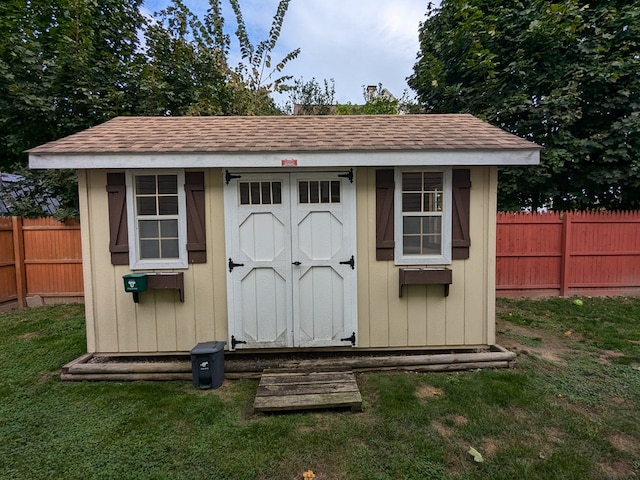 view of outdoor structure with a lawn