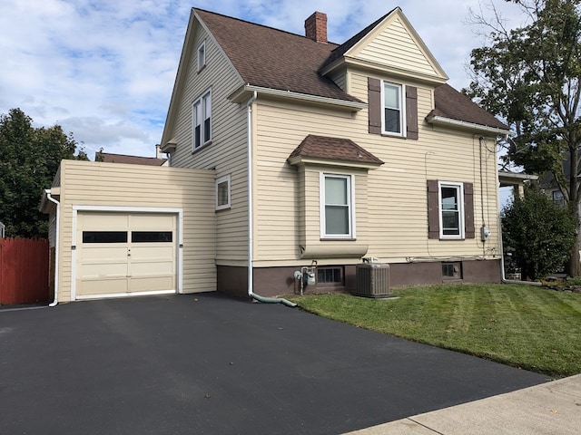 view of home's exterior featuring a yard and cooling unit