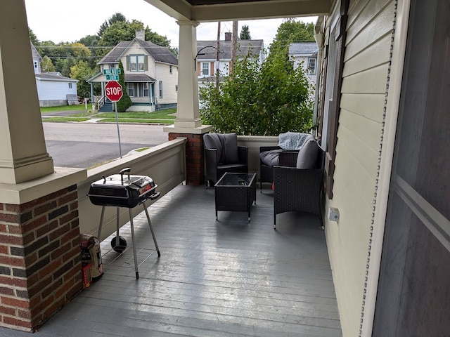 exterior space with a grill and covered porch