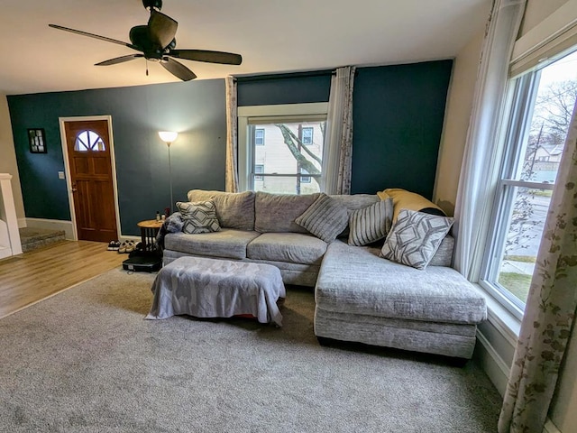 living room with a wealth of natural light, hardwood / wood-style floors, and ceiling fan