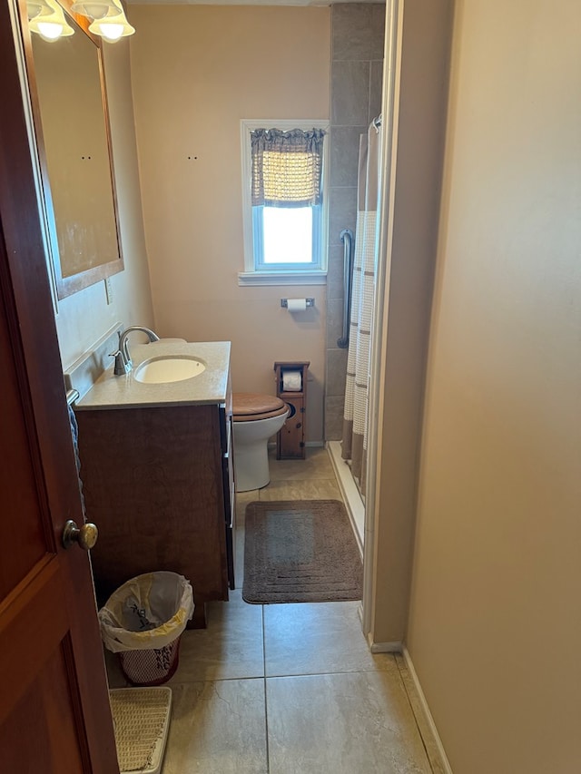 bathroom featuring tile patterned floors, vanity, toilet, and a shower with curtain