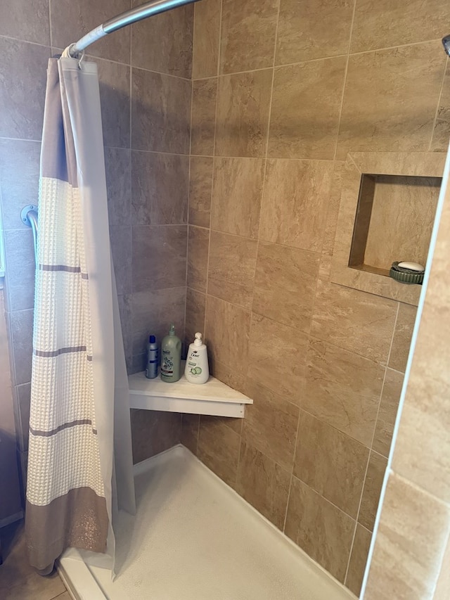 bathroom featuring curtained shower