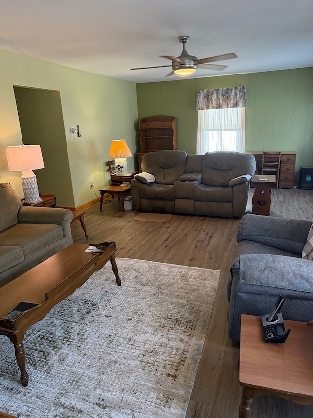 living room with hardwood / wood-style floors and ceiling fan