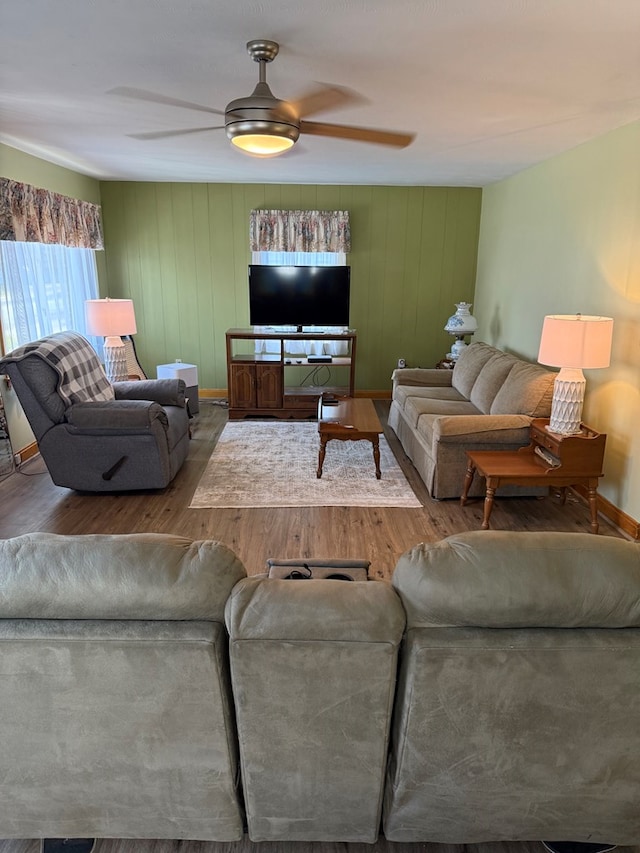 living room with hardwood / wood-style floors and ceiling fan