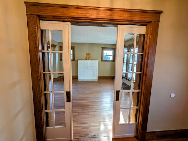 doorway to outside featuring french doors and wood-type flooring