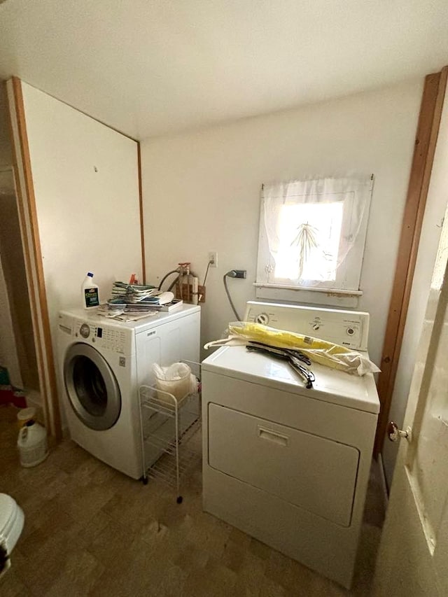 laundry area with separate washer and dryer