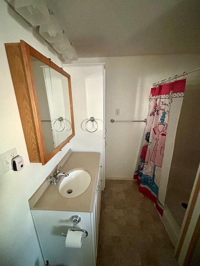 bathroom with vanity and walk in shower