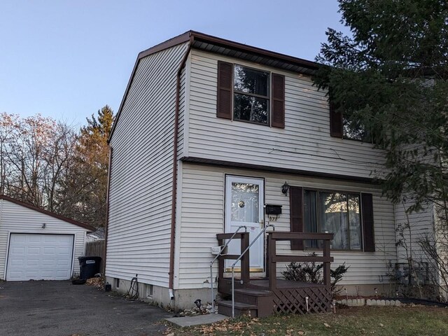 view of front of home with an outbuilding and a garage