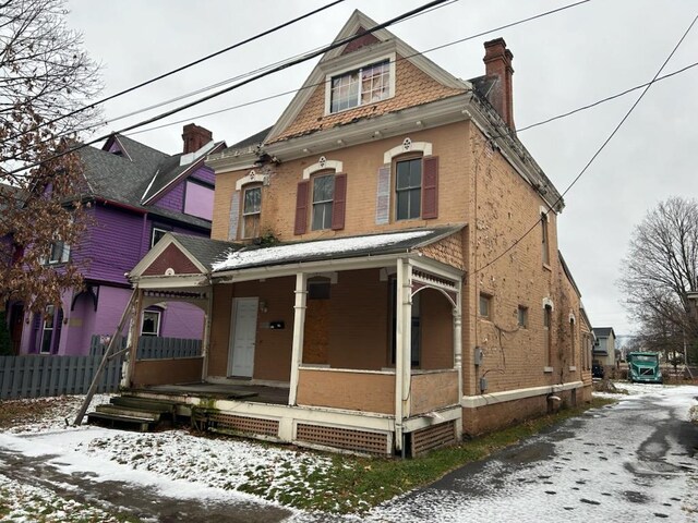 view of front of home featuring covered porch