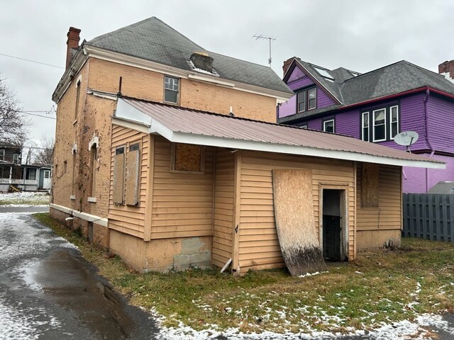 view of snow covered house