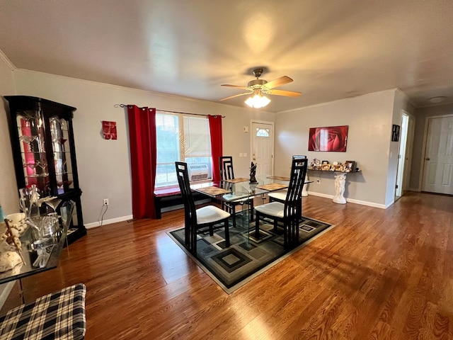 dining space with dark hardwood / wood-style floors, ceiling fan, and crown molding