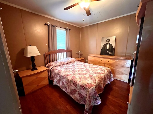 bedroom with ceiling fan, dark hardwood / wood-style floors, and ornamental molding