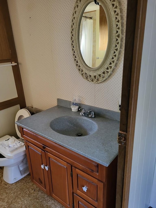 bathroom with vanity and toilet