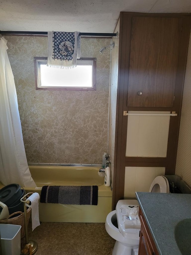 full bathroom with shower / bathtub combination with curtain, vanity, and toilet