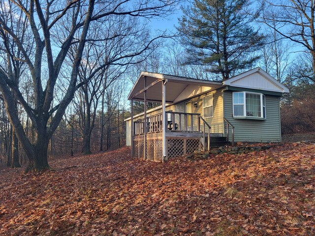 view of side of home with a porch