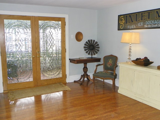 foyer with french doors and dark hardwood / wood-style flooring