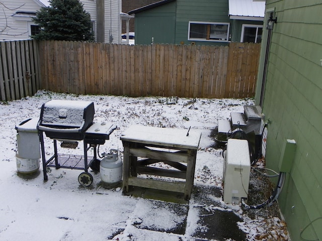 view of yard layered in snow