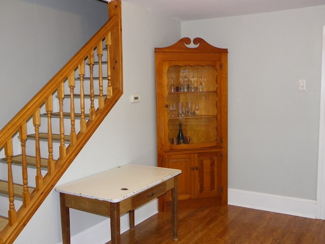 staircase featuring hardwood / wood-style floors