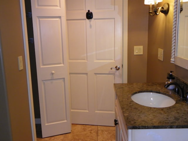 bathroom featuring tile patterned floors and vanity