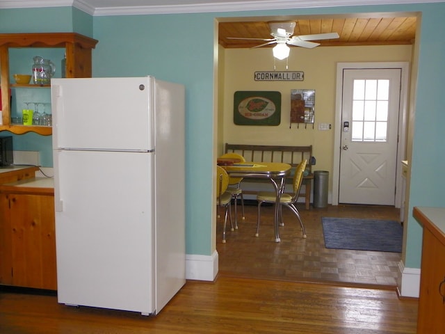 kitchen with ceiling fan, crown molding, white refrigerator, wooden ceiling, and hardwood / wood-style floors