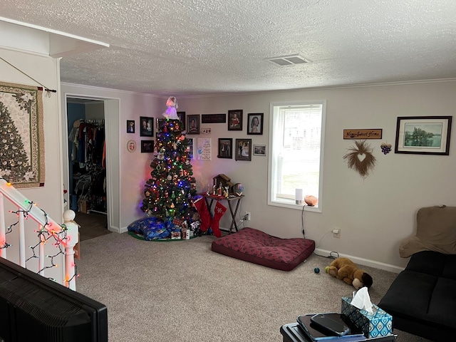 game room featuring carpet flooring and a textured ceiling