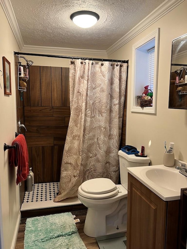 bathroom with vanity, crown molding, wood-type flooring, and a textured ceiling