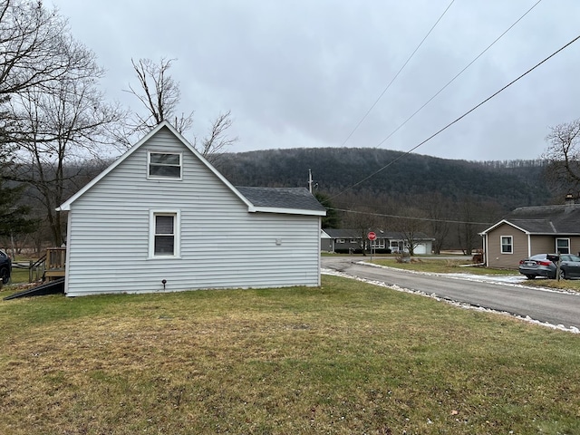 view of home's exterior with a yard