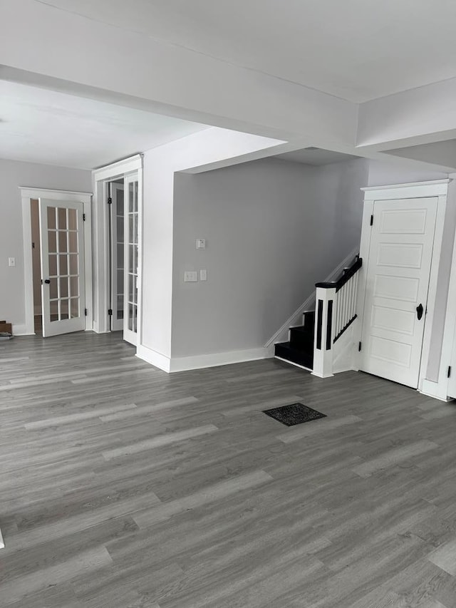 unfurnished living room with hardwood / wood-style floors