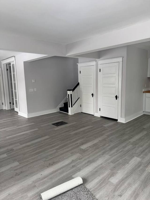 unfurnished living room with hardwood / wood-style flooring