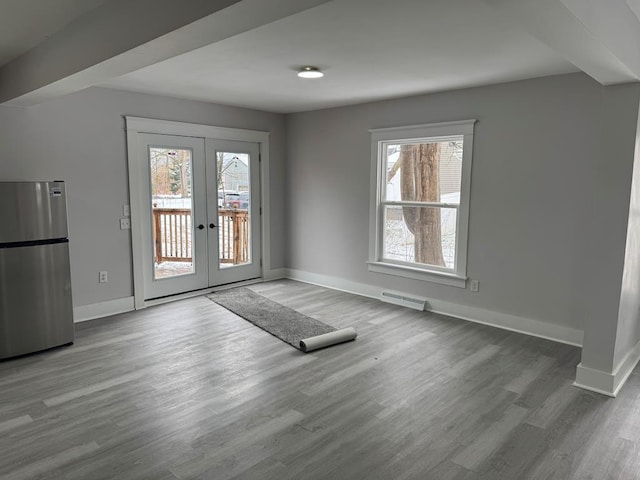 doorway to outside with wood-type flooring and french doors