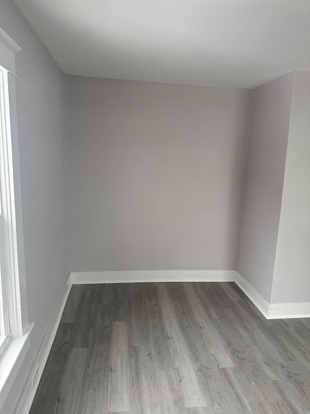 unfurnished room featuring hardwood / wood-style floors