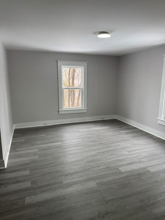 spare room featuring dark hardwood / wood-style flooring