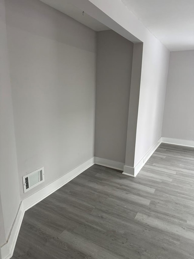 unfurnished room featuring hardwood / wood-style floors