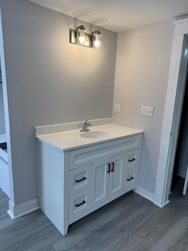 bathroom with wood-type flooring and vanity