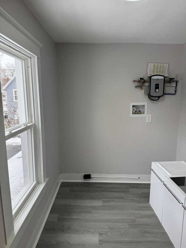 laundry room featuring cabinets, hookup for a washing machine, and dark hardwood / wood-style floors