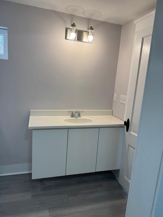 bathroom featuring hardwood / wood-style flooring and sink