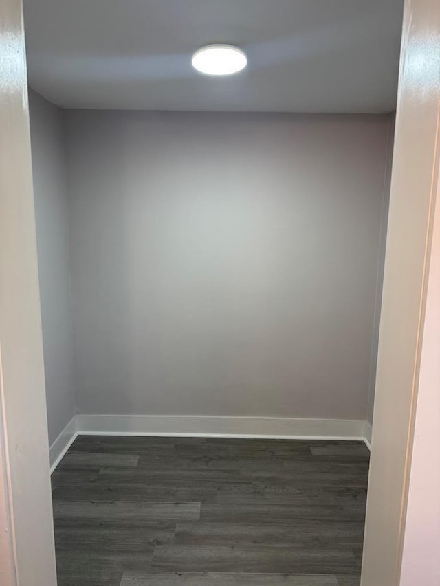 empty room featuring dark wood-type flooring