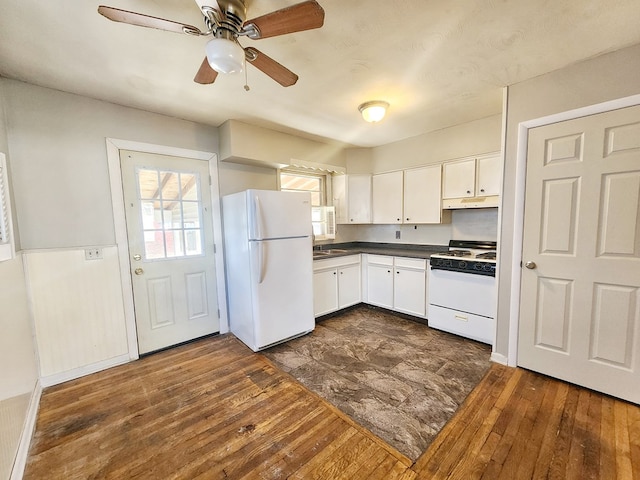 kitchen featuring ceiling fan, sink, dark wood-type flooring, white appliances, and white cabinets